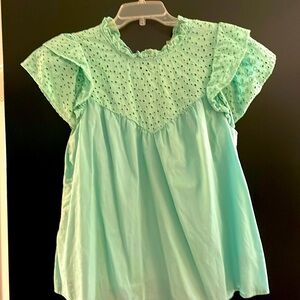 Ruffled blouse with eyelet detailing